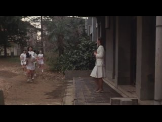 female teacher - in front of the students (1982)